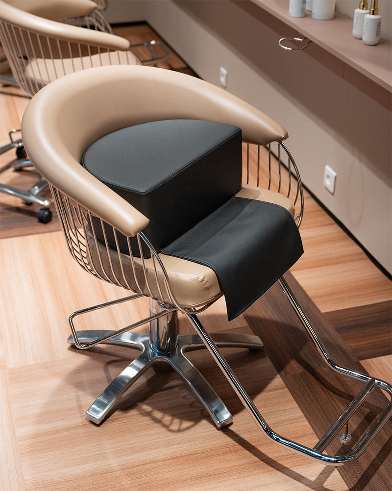 Lift child cushion for styling chair